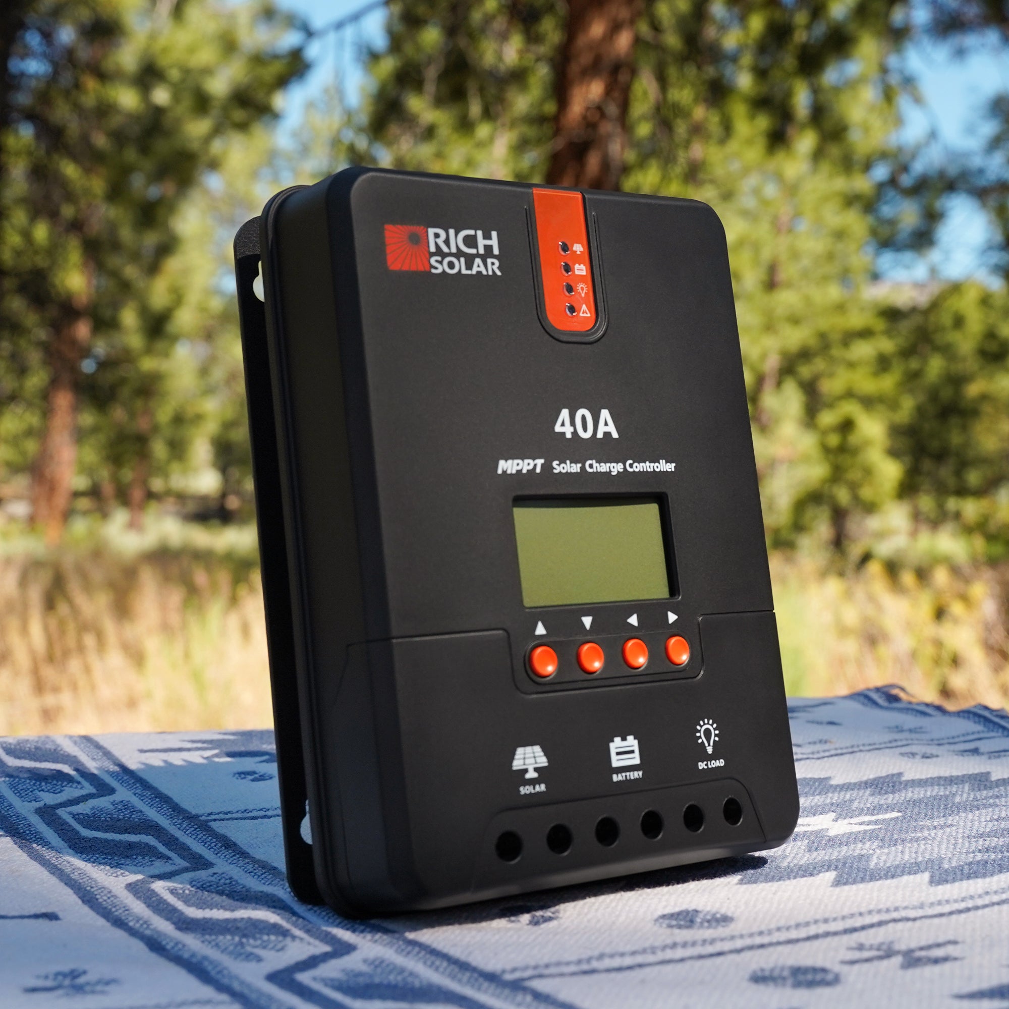 Rich Solar 40A MPPT solar charge controller standing outdoors with LCD screen and LED indicators