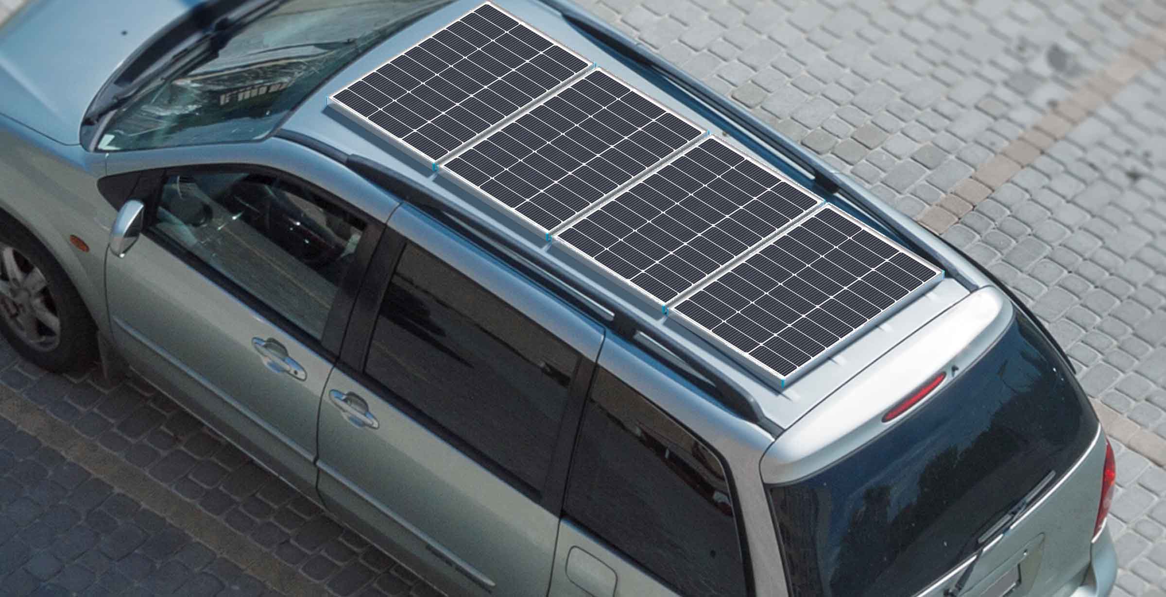Renogy 100W panels positioned on a minivan roof